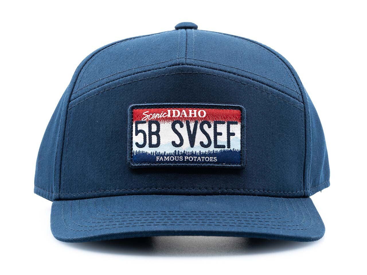 a blue baseball cap with an idaho license plate with 